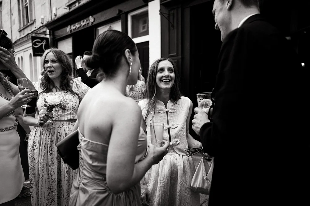 Black and white photograph of Patrick and Ruby with their guests