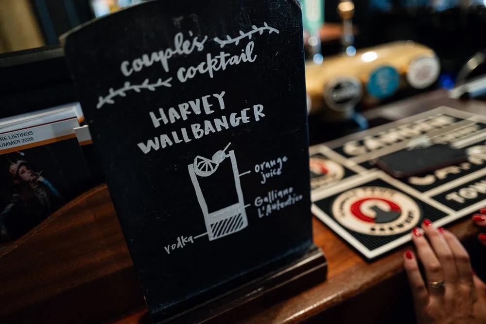 A detail of the chalkboard menu and beer mats at The Alma Tavern
