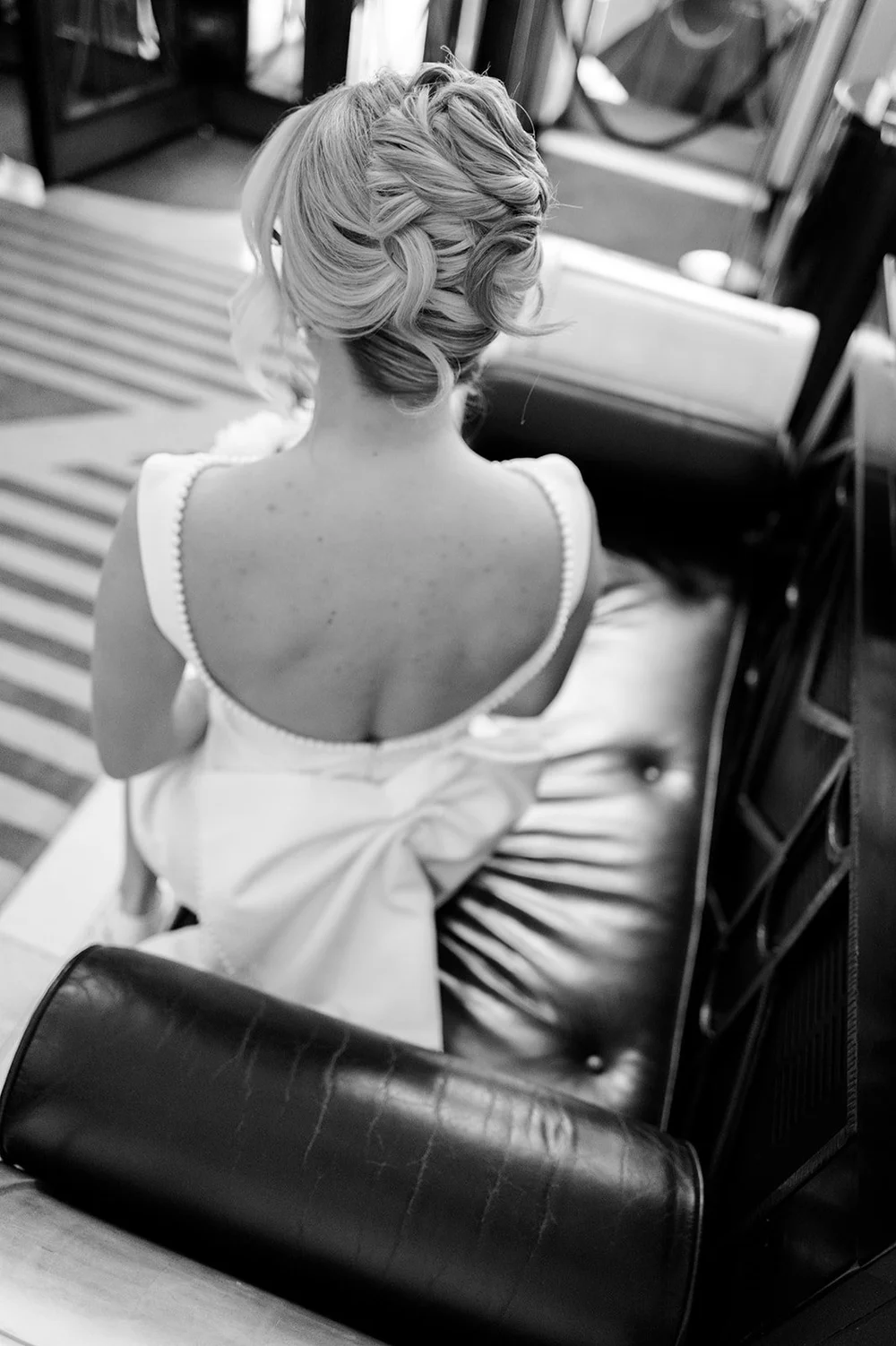 Black and white photograph of the bow on the back of Charley&rsquo;s Babyboo wedding dress