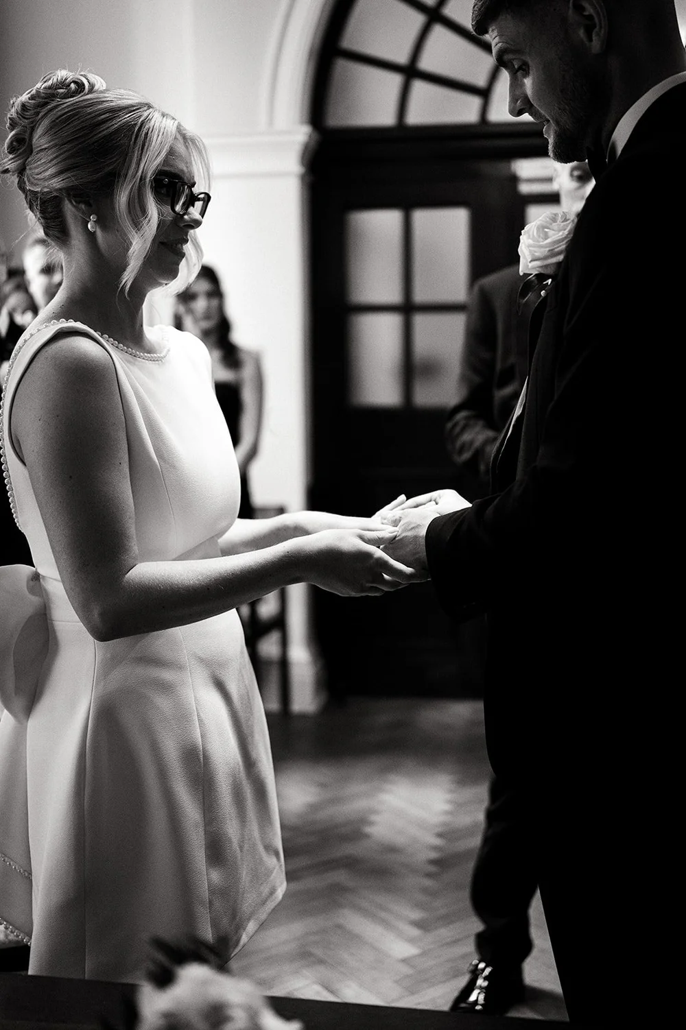 Black and white photograph of Charley reading her vows at Chelsea Old Town Hall