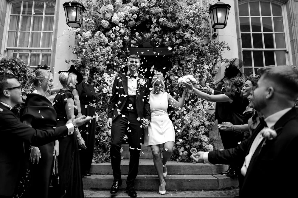 Black and white photograph of Charley and Joe with their guests outside the town hall