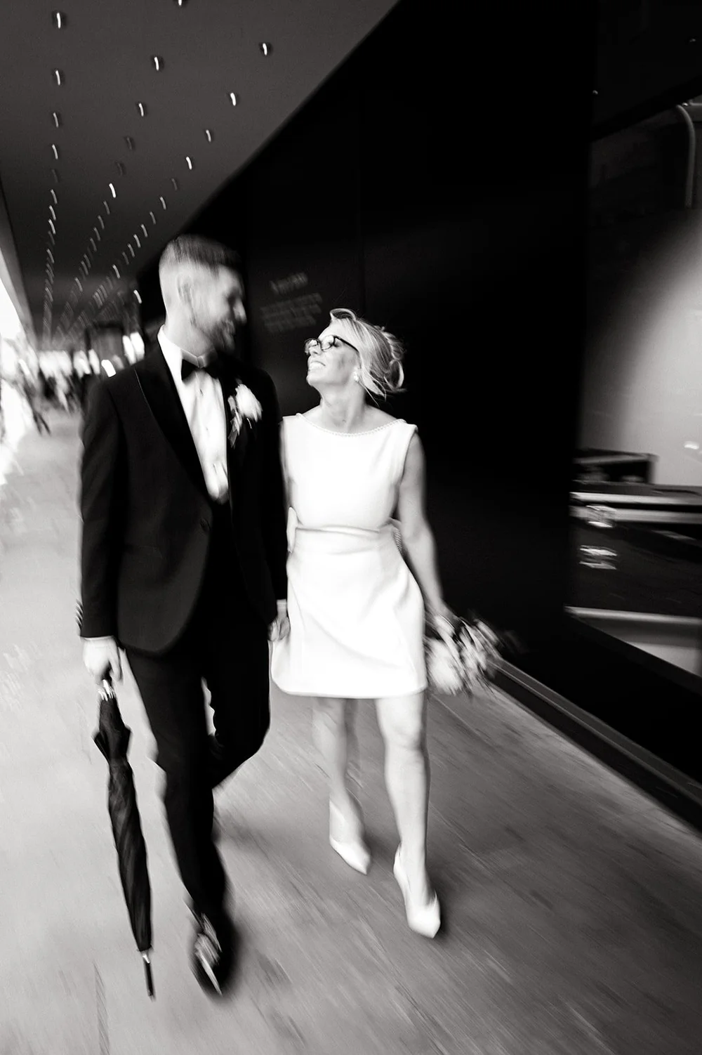 Black and white photograph of Charley and Joe walking down the King&rsquo;s Road in the rain