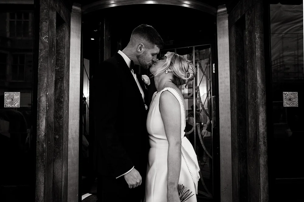 Black and white photograph of Charley and Joe in a doorway in Mayfair
