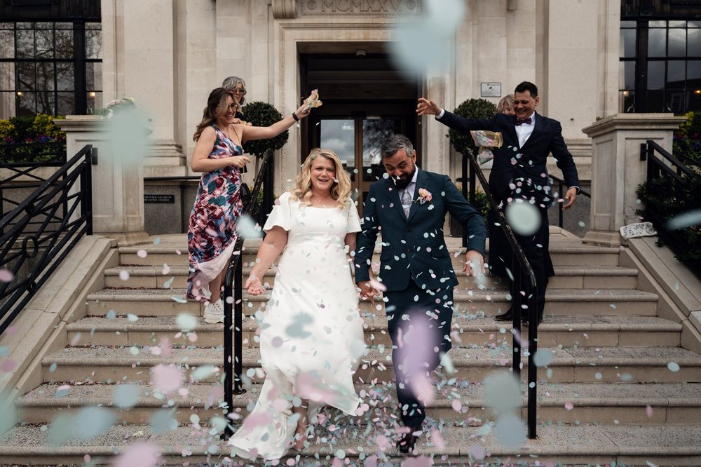 Confetti on the steps of Islington Town Hall, London wedding photography by Oliver Holder