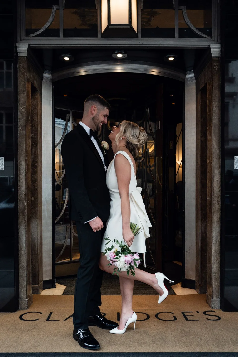 Charley and Joe outside Claridge's on their London wedding day