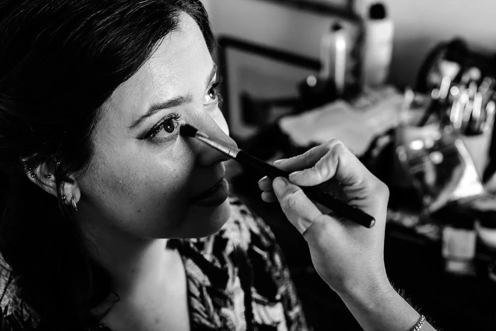 Bride having her make up applied on the wedding morning