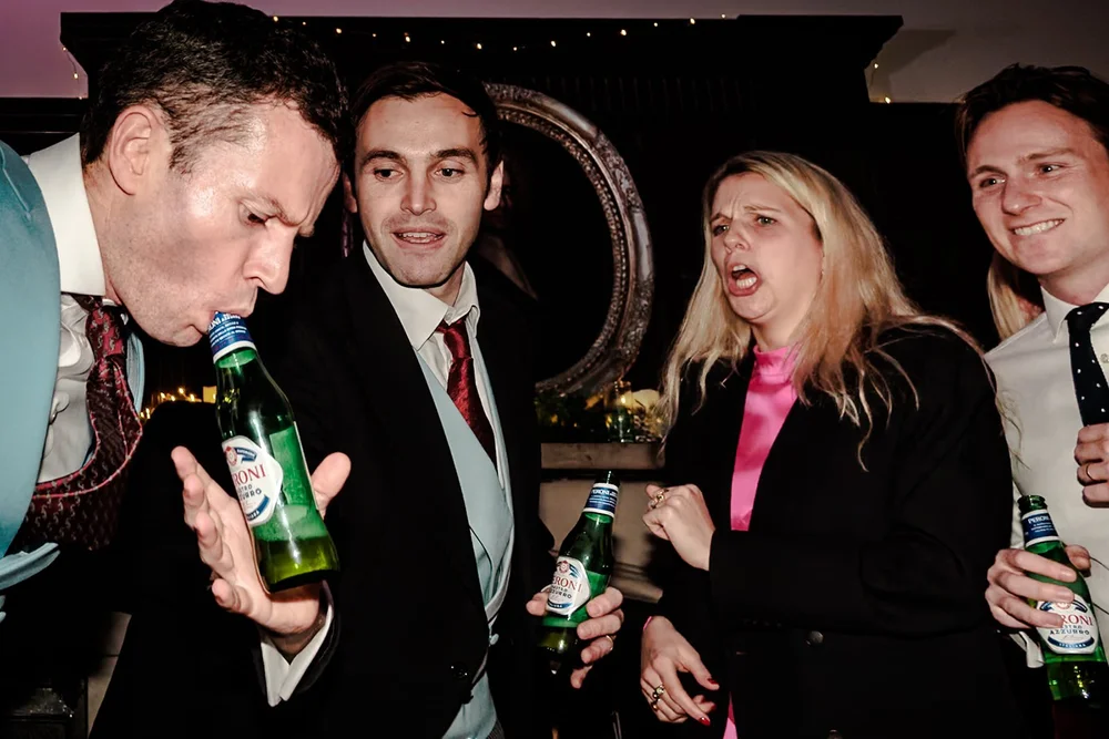 Guests sharing bottles of beer late in the evening