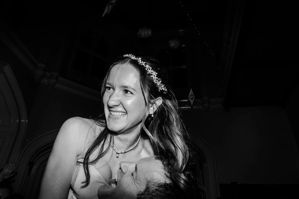 Bride laughing in the dark late in the evening