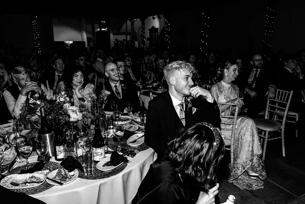 A guest resting their head on the table during a long candlelit dinner