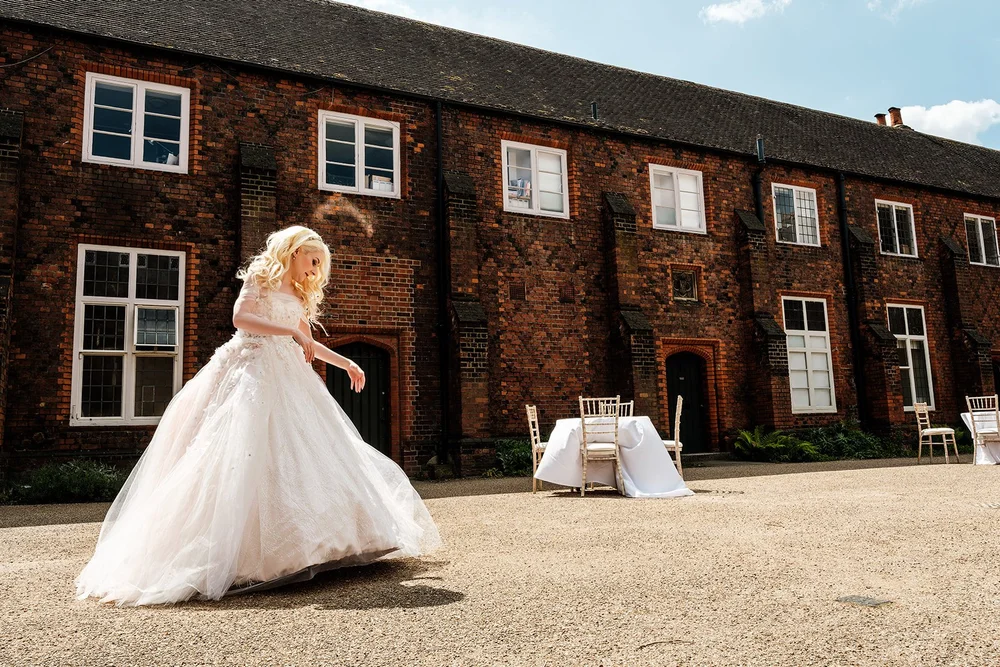 Bride crossing the courtyard on her way to the ceremony
