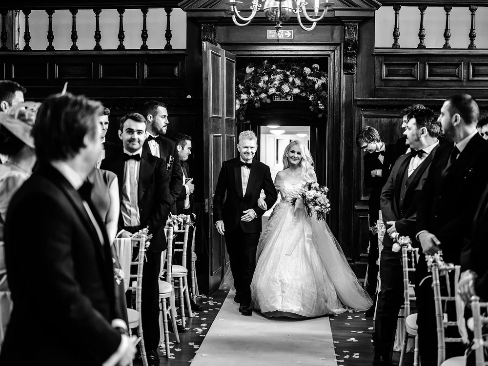 Bride walking down the aisle with her father