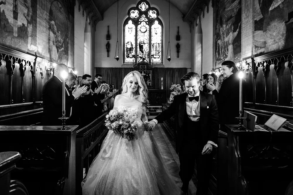 Bride and groom leaving the chapel after their blessing