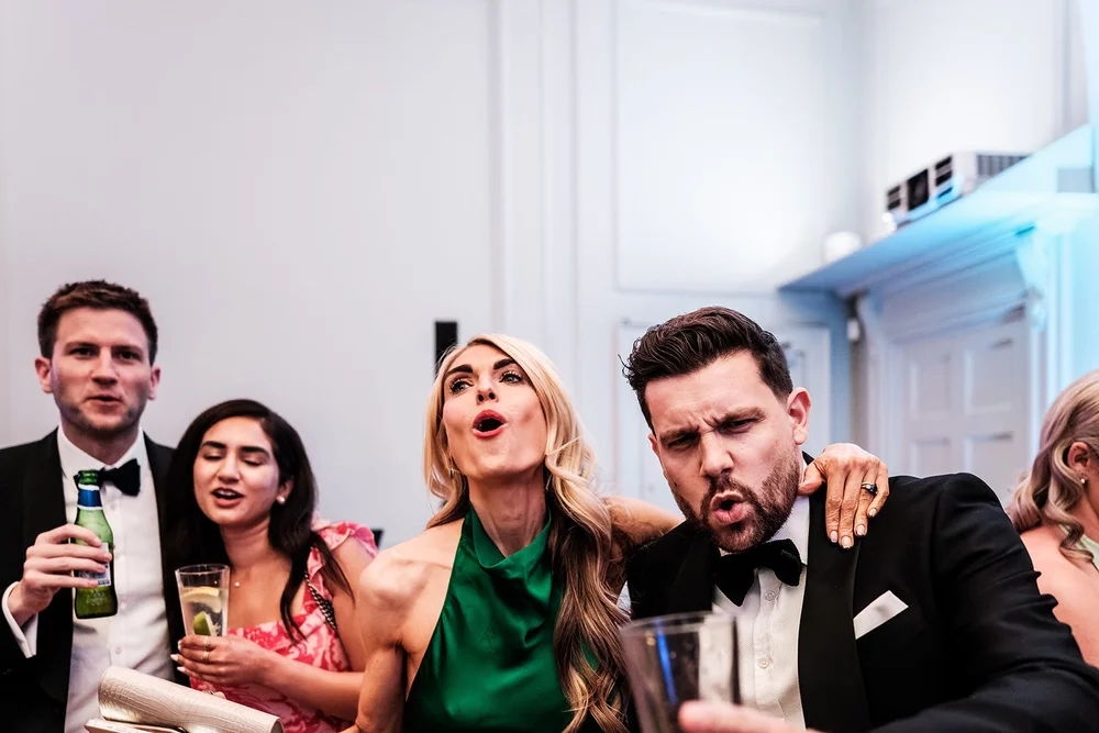 Guests pulling faces together on the dance floor
