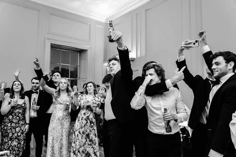 Guests dancing with their arms in the air
