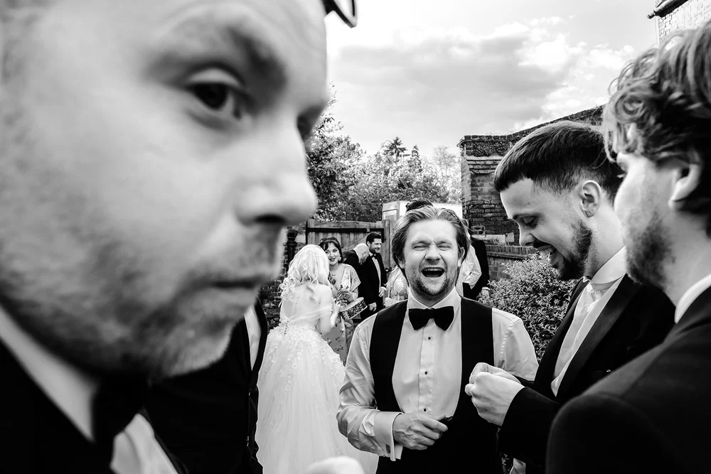 Guests laughing together during the reception