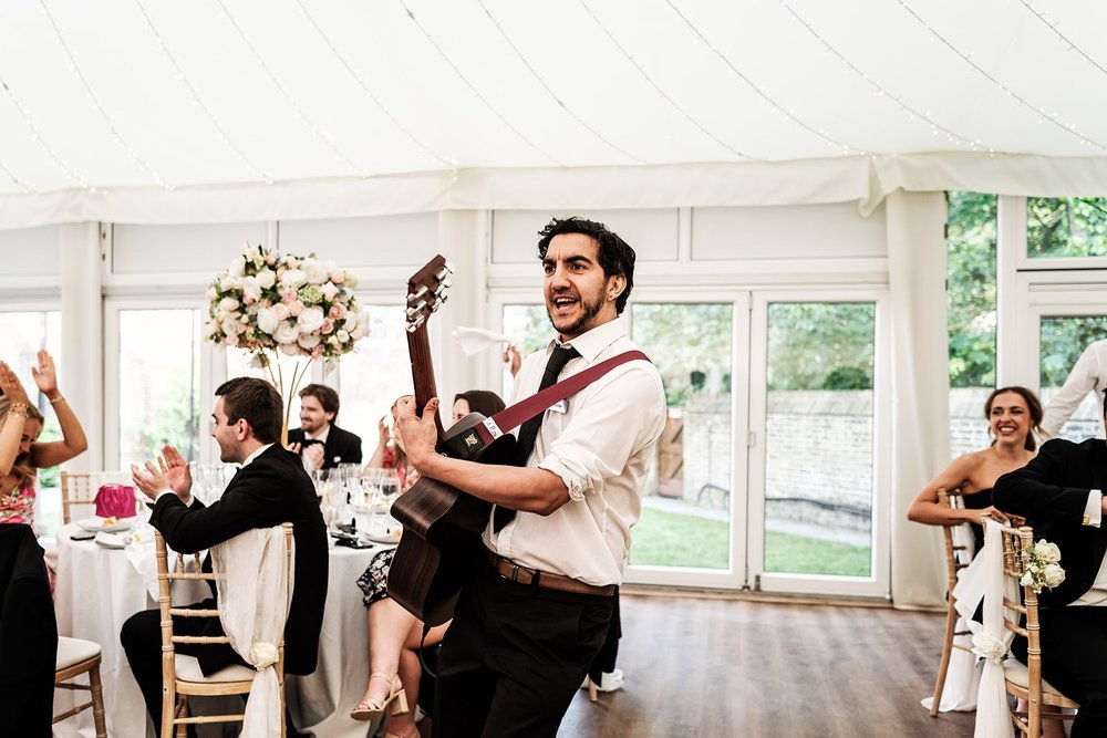 One of the singing waiters performing between the tables