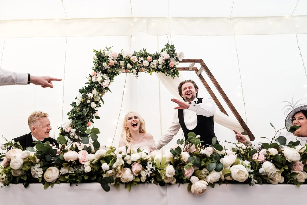 The groom reacting to a line in one of the speeches