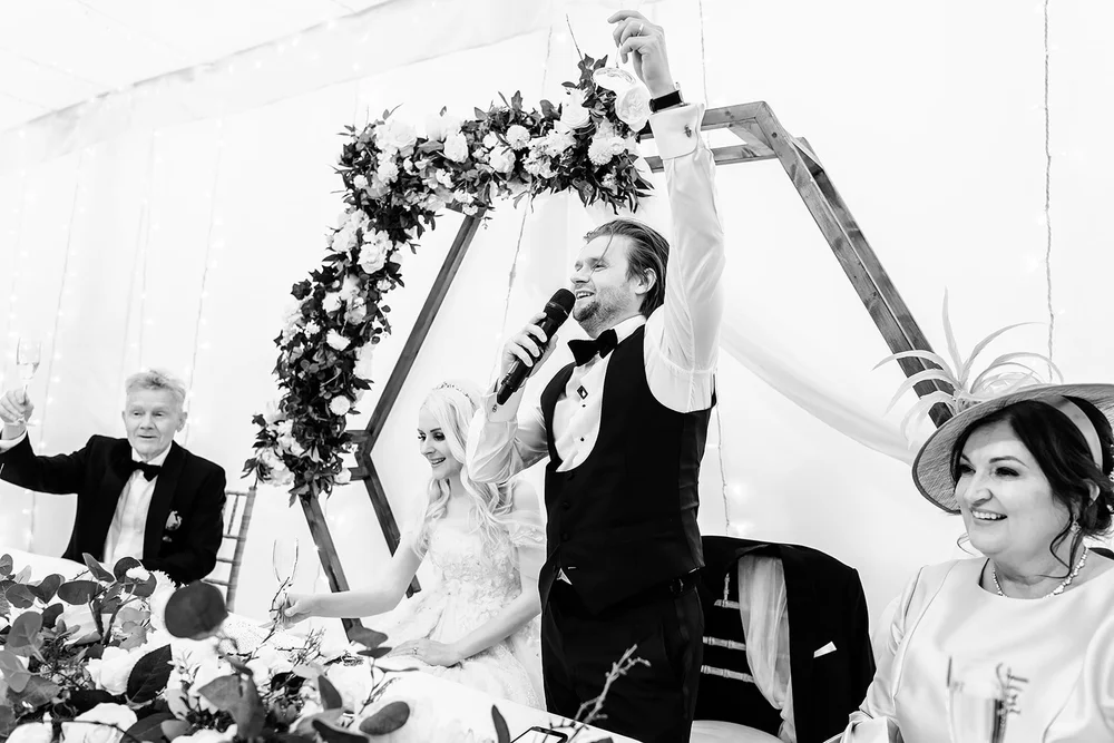 A singing waiter finishing his number to applause