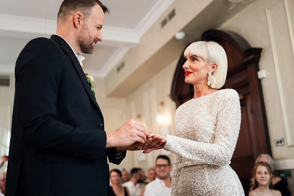 Guests watching the ceremony in the Brydon Room at Chelsea Old Town Hall