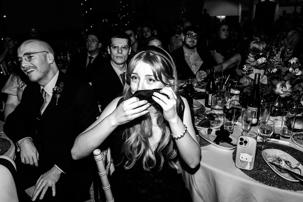 Guests laughing during the wedding speeches at Fabrica