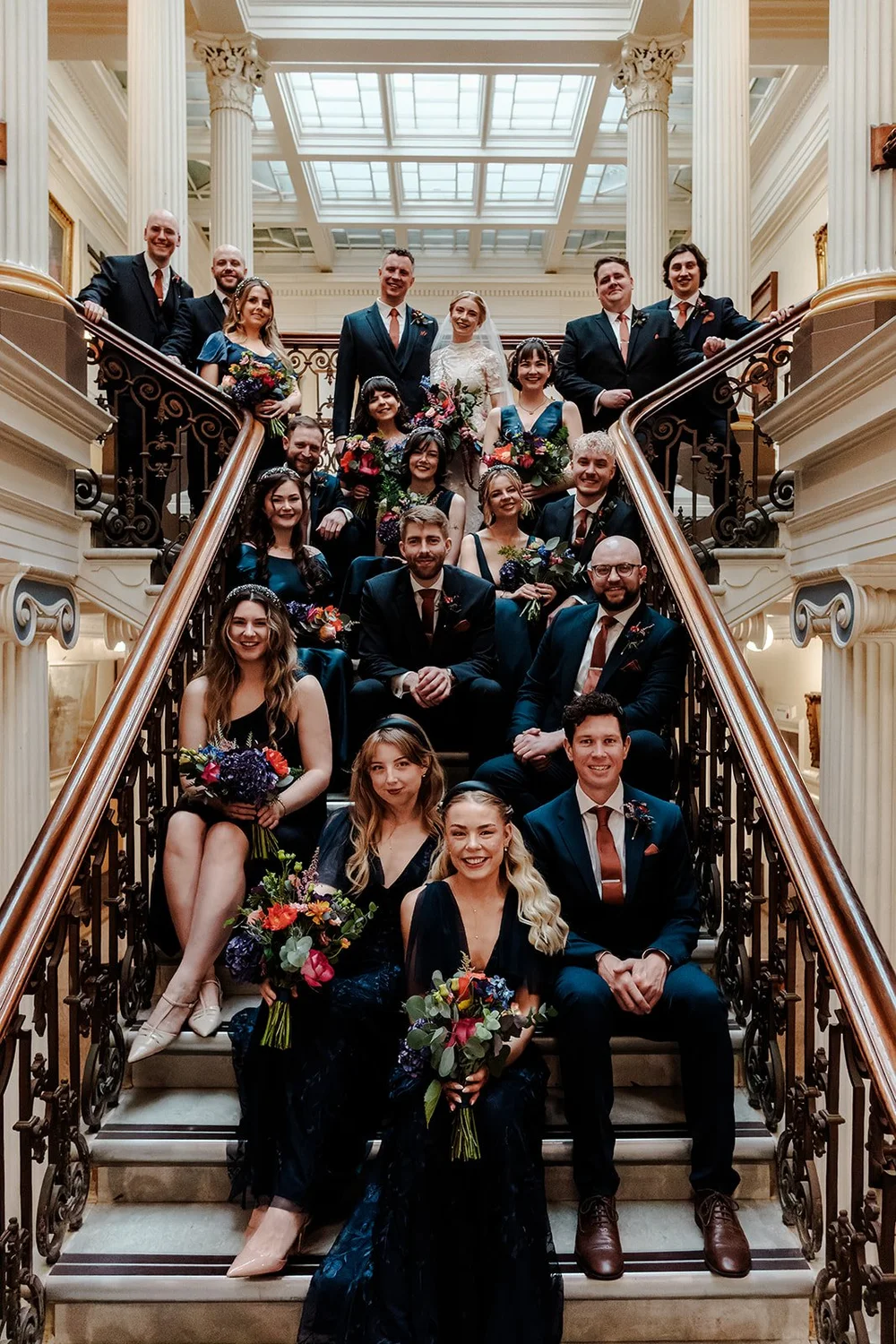 Wedding guests photographed from above on the Brighton Town Hall staircase
