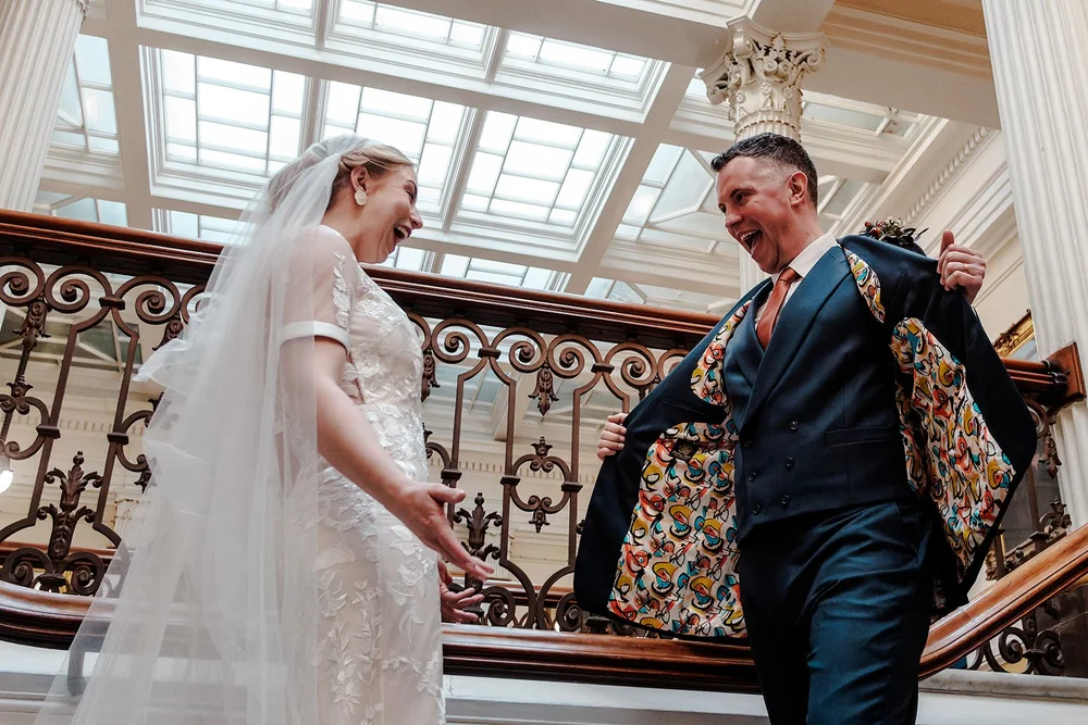 Grace and Jordan coming down the grand staircase at Brighton Town Hall