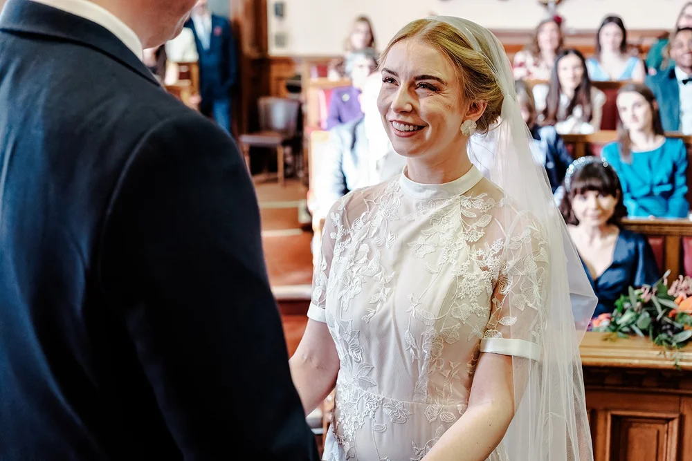 Grace walking towards Jordan during their Brighton Town Hall ceremony
