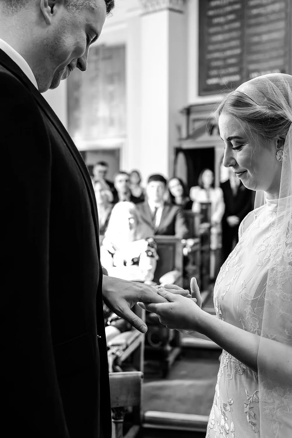 Grace and Jordan exchanging rings in the Council Chamber