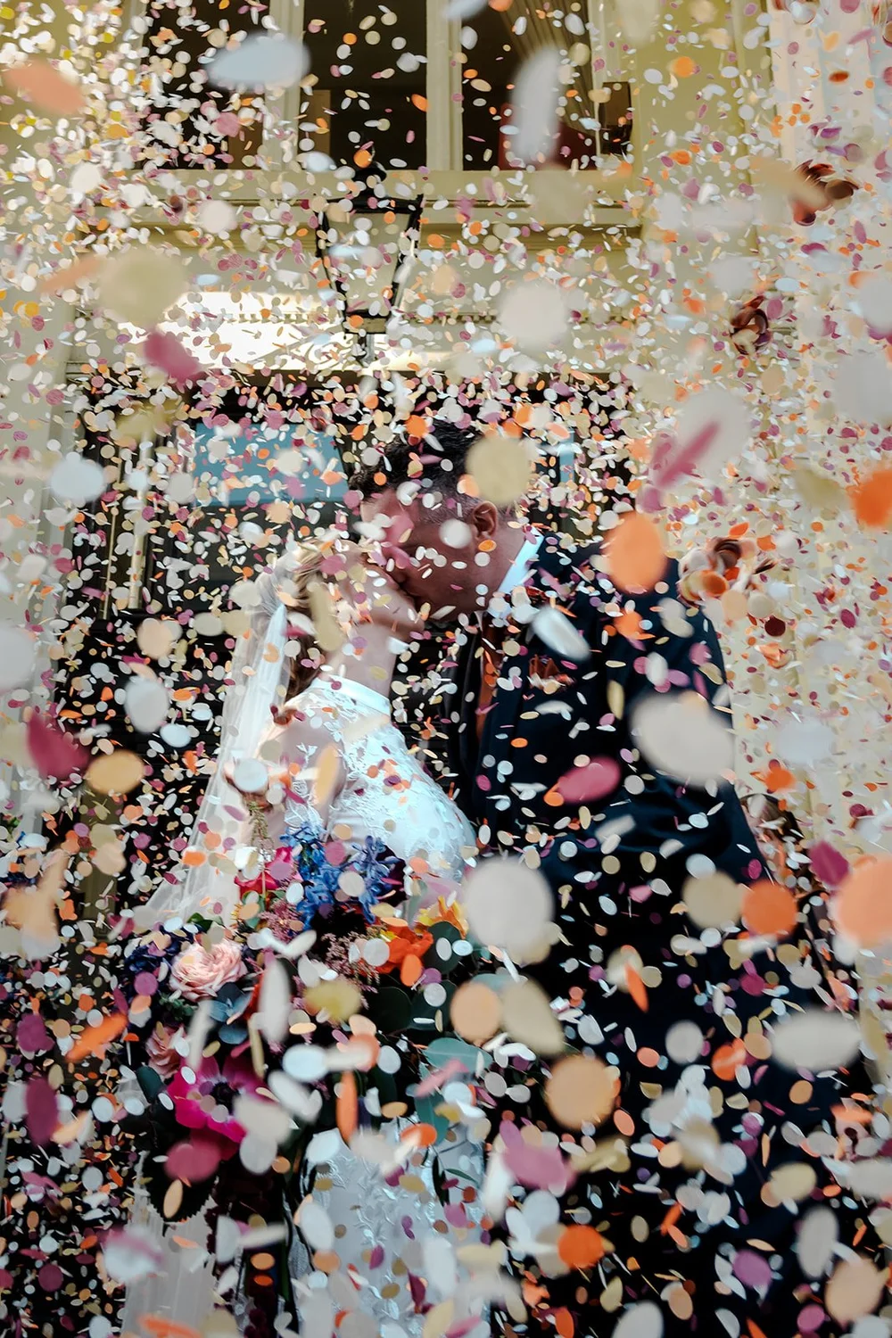 A dense cloud of confetti at a Brighton Town Hall wedding