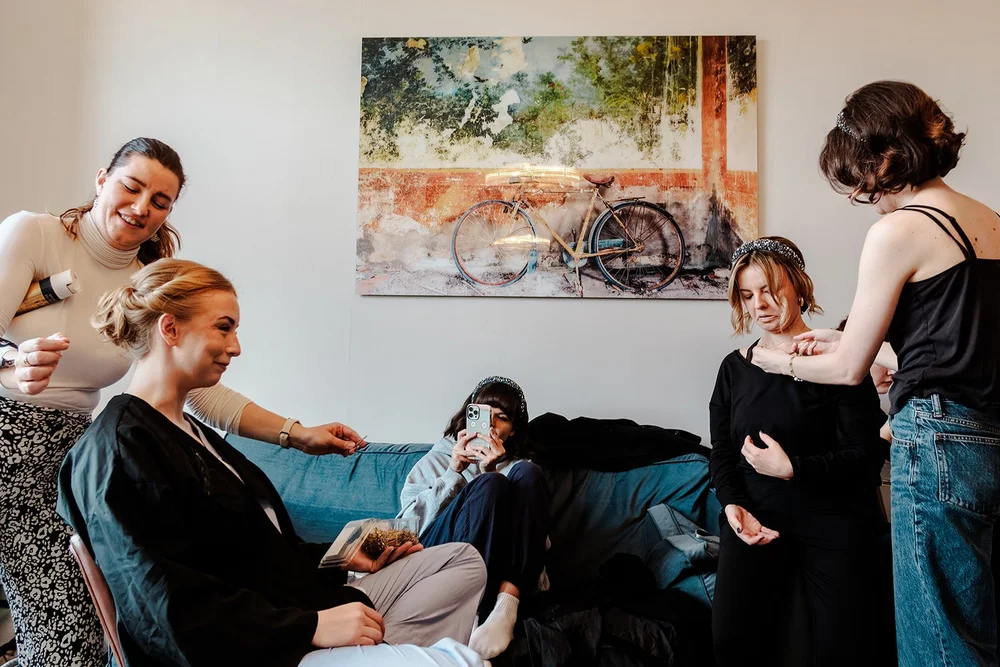 Bridesmaids relaxing in the getting ready room before a Brighton wedding