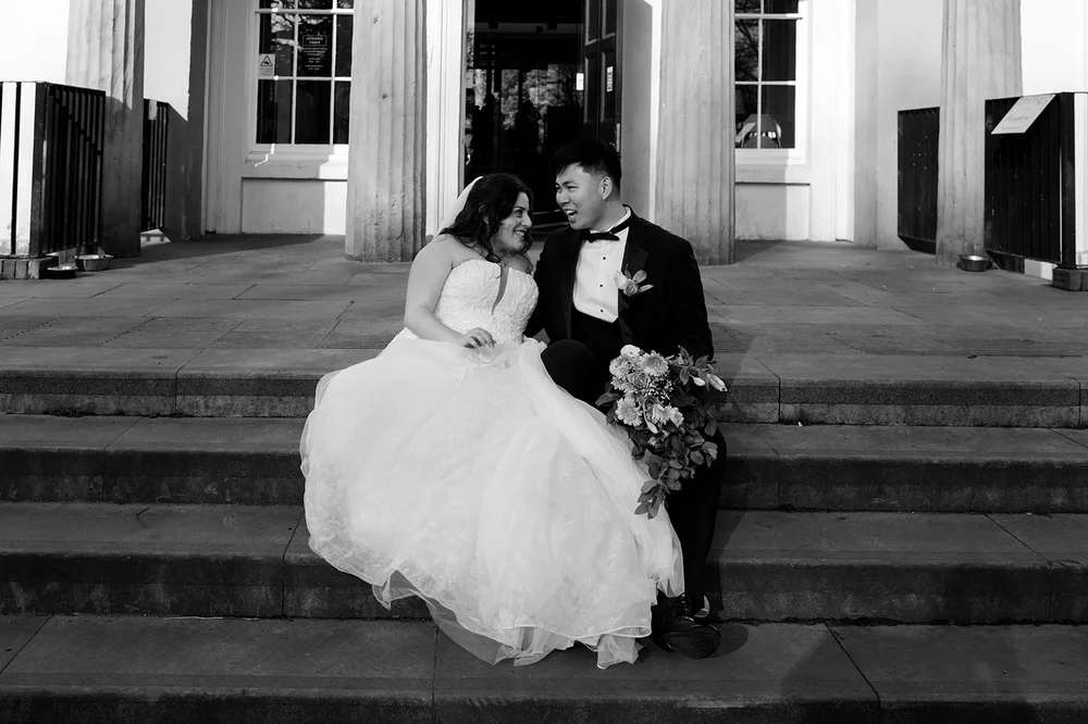 Luisa and Ray on the steps of Calderstones Mansion House