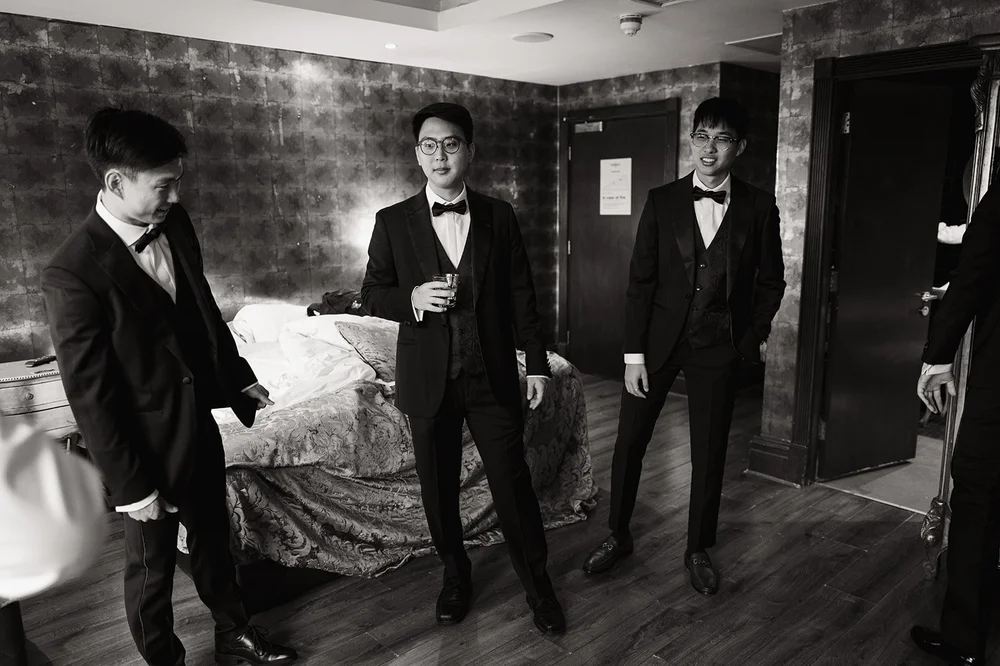 The groomsmen in black tie at The Shankly Hotel, Liverpool