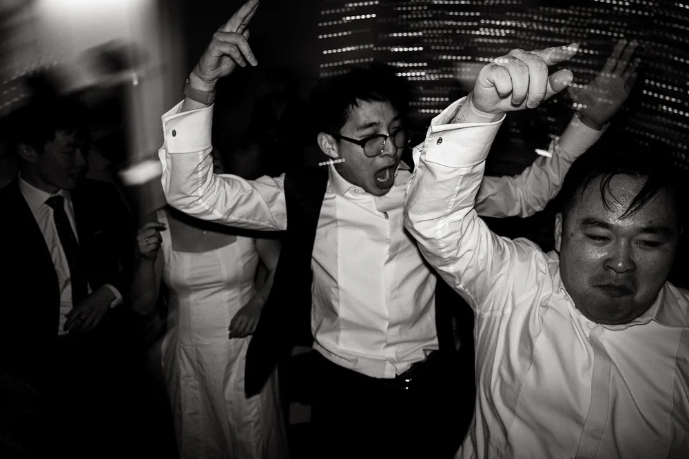 Guests dancing under blurred lights during la hora loca
