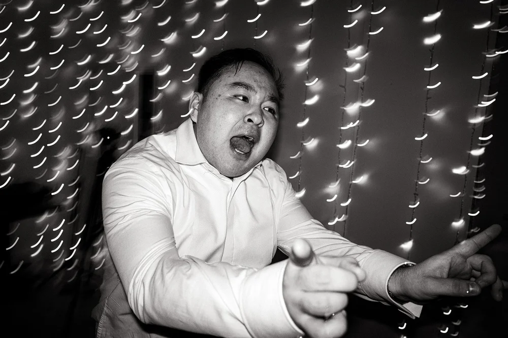 A guest mid dance during crazy hour at a Liverpool wedding