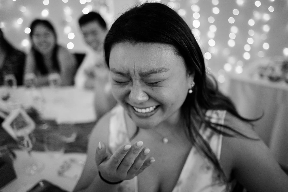 Luisa laughing during the wedding speeches in Liverpool