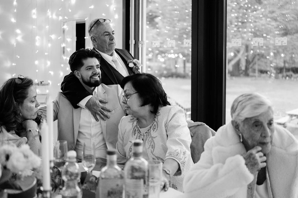 Guests reacting to a speech at a Liverpool wedding