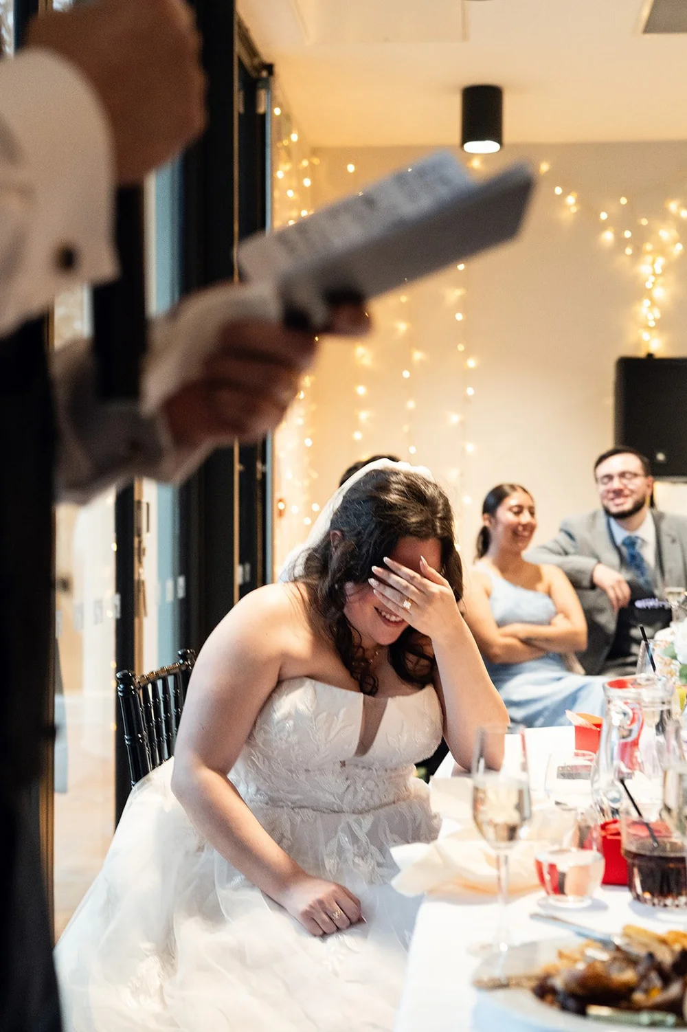 Luisa listening to a speech at her Liverpool wedding