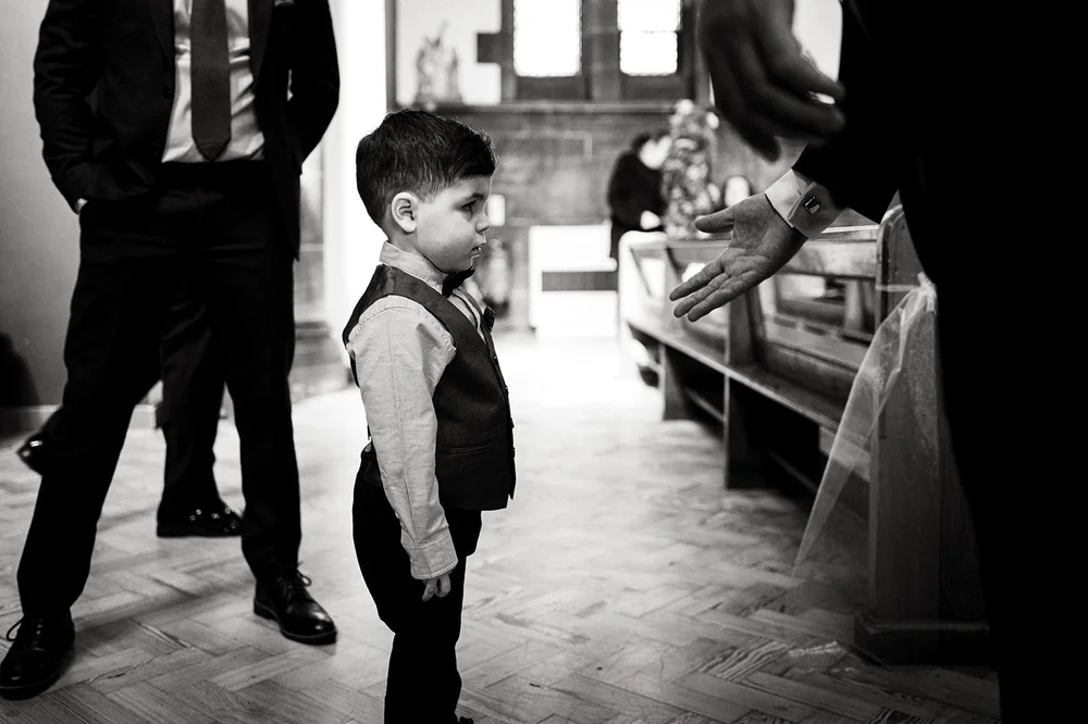 A page boy waiting inside St Anne&rsquo;s Church, Old Swan