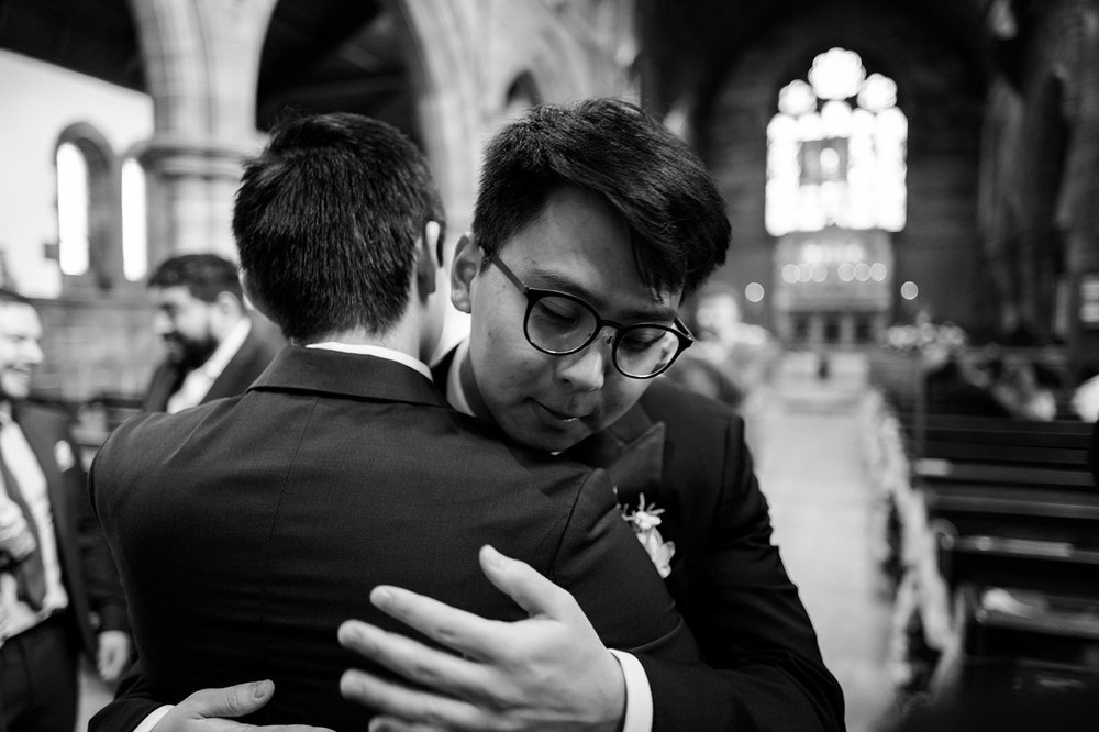 Ray greeting a guest before the ceremony at St Anne&rsquo;s Church