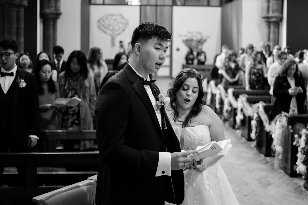 Reading the vows during a church wedding in Liverpool