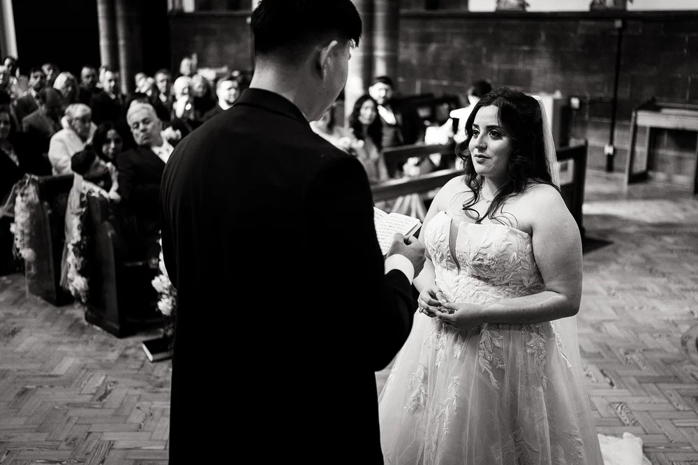 Luisa and Ray during their ceremony at St Anne&rsquo;s Church