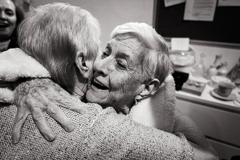 Two guests embracing after the ceremony at a Liverpool wedding