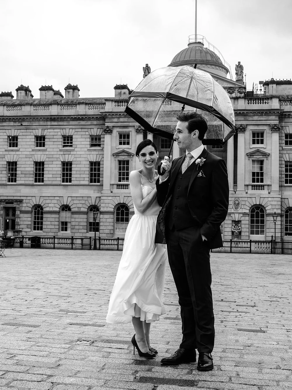 Wedding couple outside Somerset House in central London &mdash; documentary wedding photography capturing authentic moments by Oliver Holder