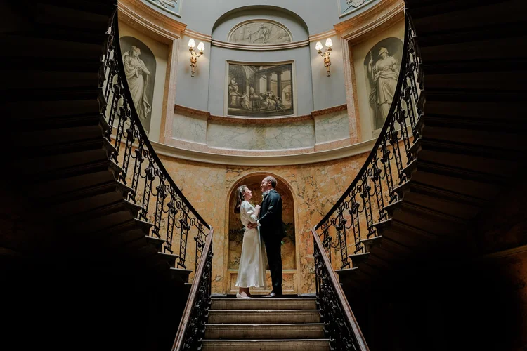 Wedding guests celebrating and laughing during reception — candid reportage photography by Oliver Holder