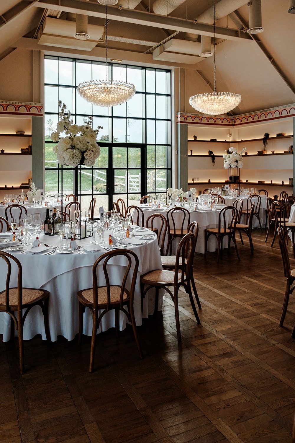 Chandeliers and the tall windows in Poplar Hall at Limekiln