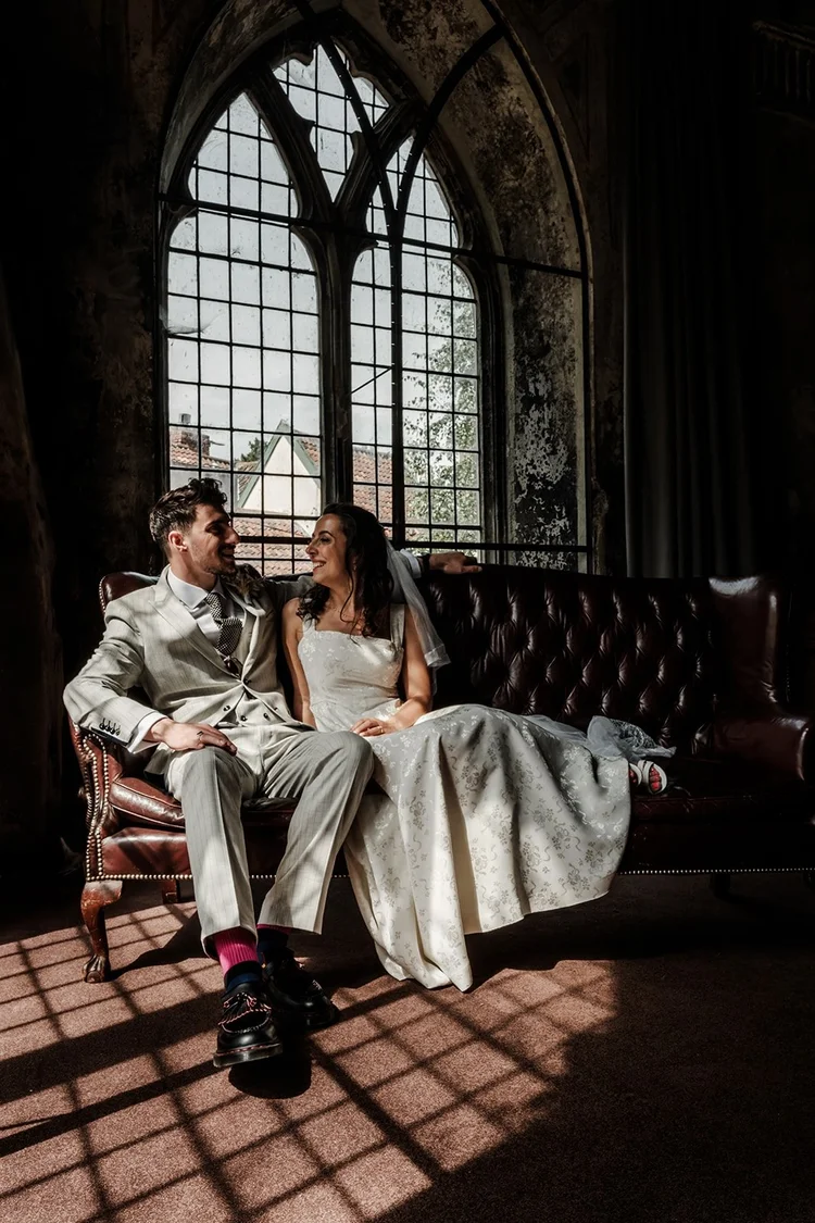 Bride and groom natural couple portrait in golden light — documentary wedding photography by Oliver Holder