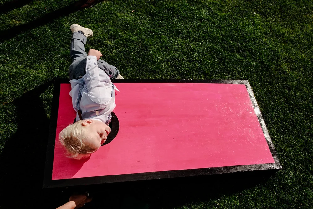 The pageboy claiming the cornhole board at Limekiln