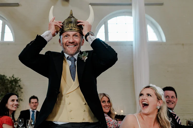 Candid laughter during wedding speeches — unposed documentary wedding photography by Oliver Holder UK