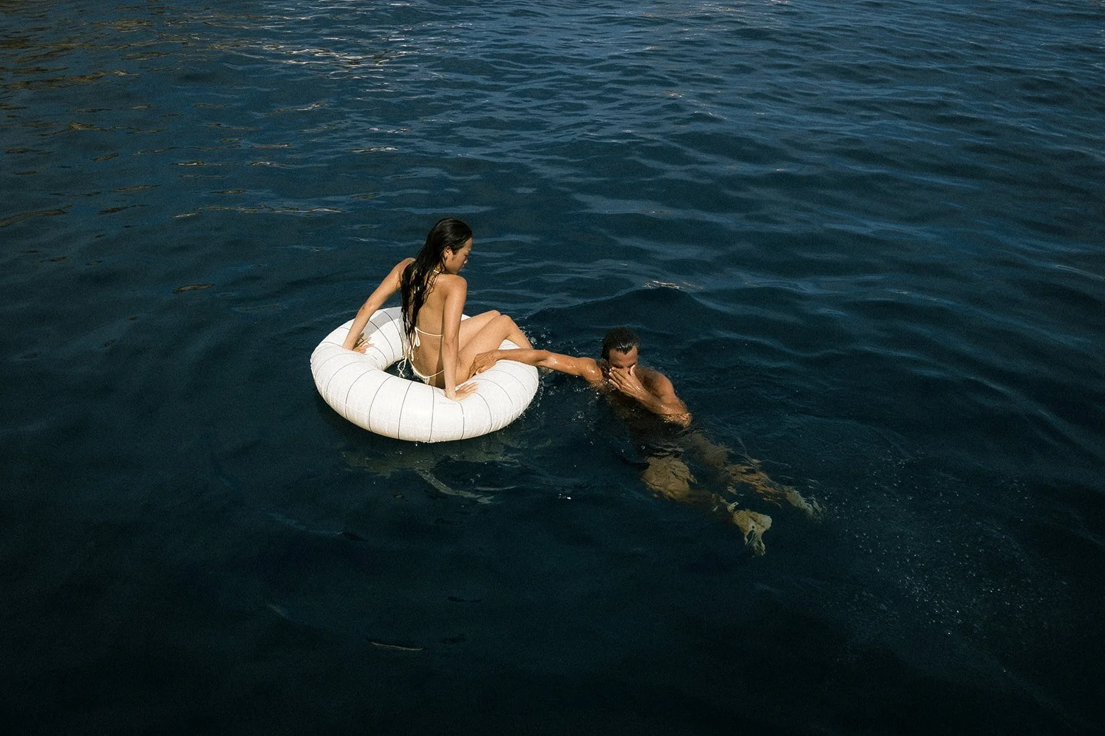 Luxury wedding weekend captured through documentary and editorial photography during a private sail for the bride and groom through the coastal waters of Sicily, Italy