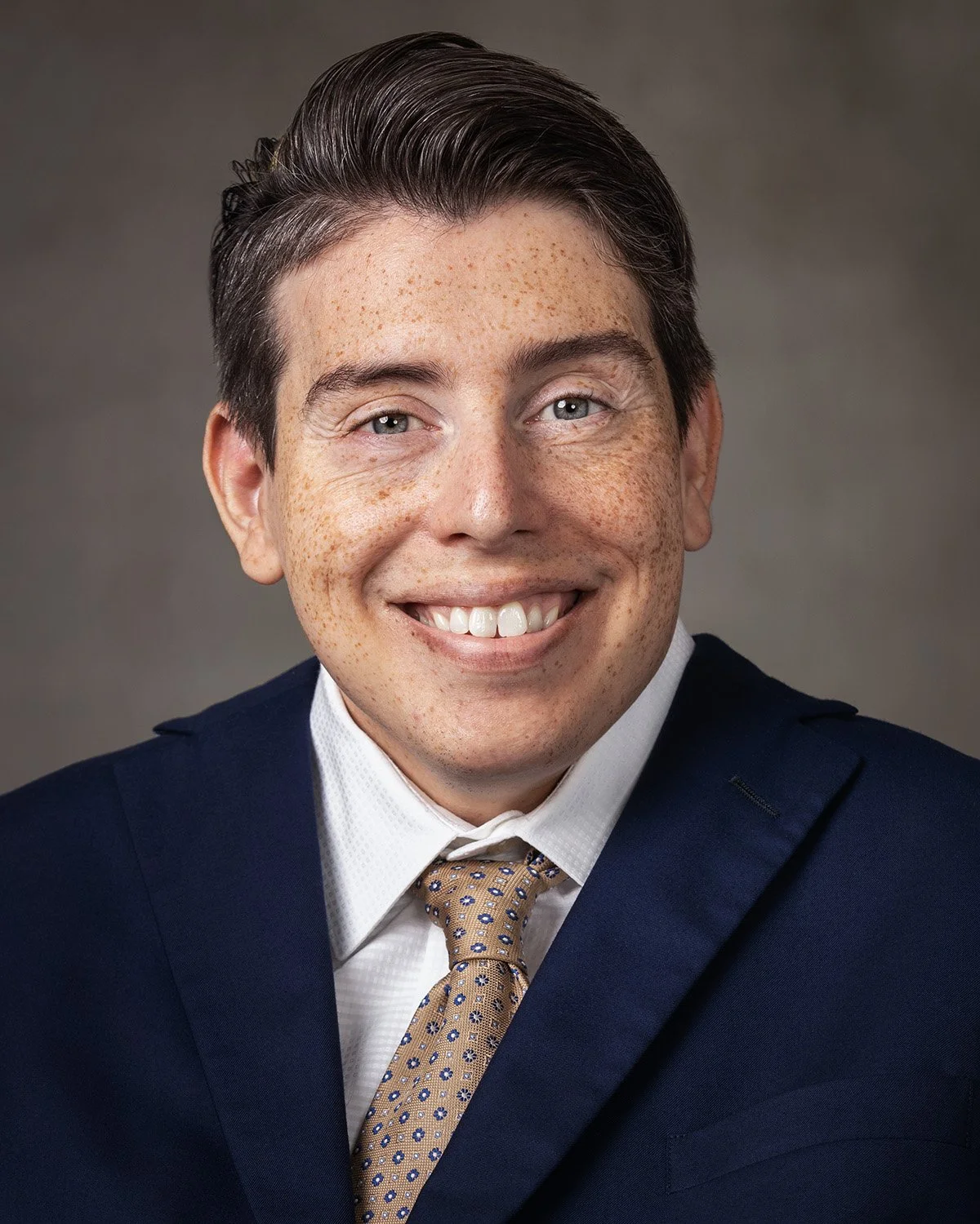 Headshot of James P Anderson in a suit